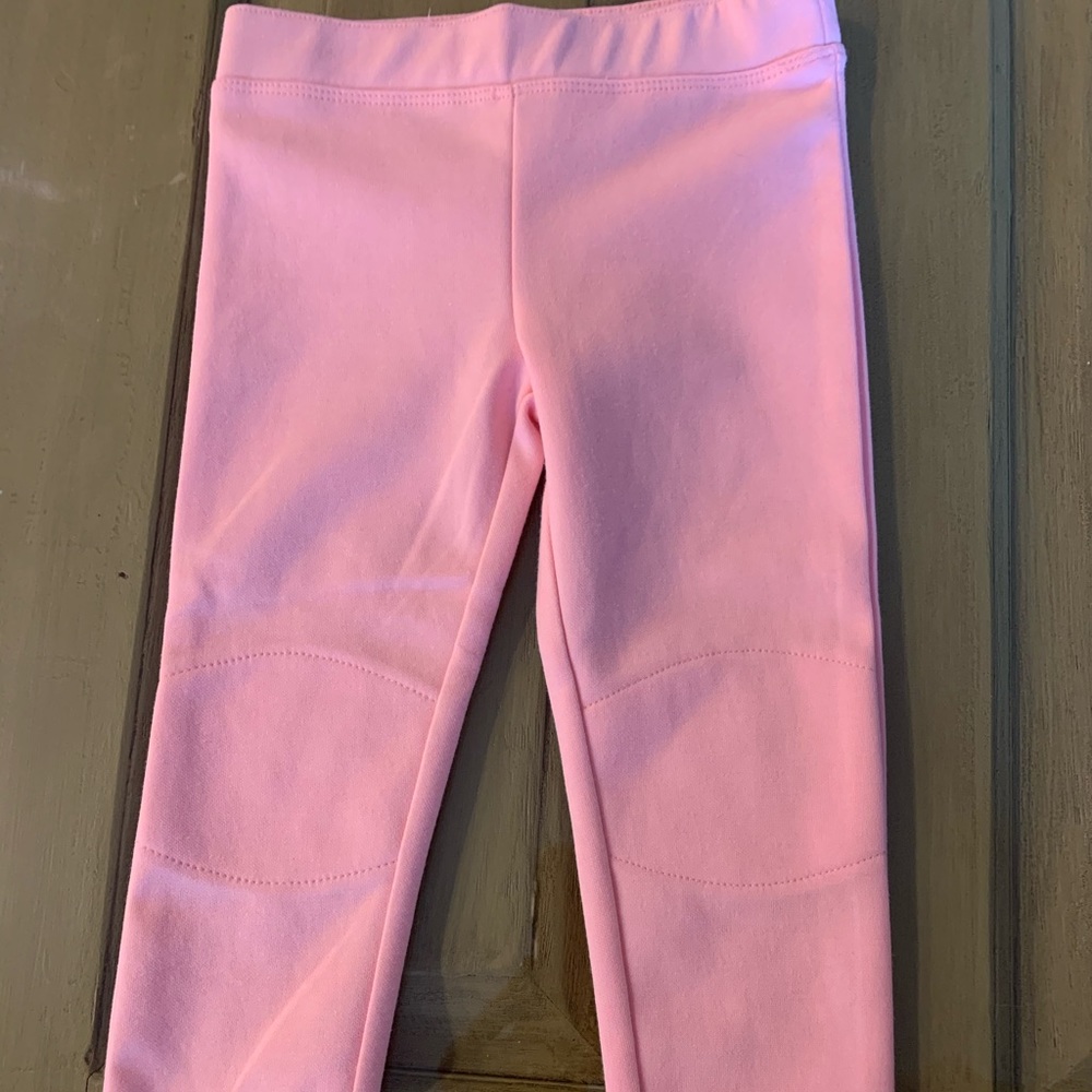 Girls pink leggings with reinforced knee.